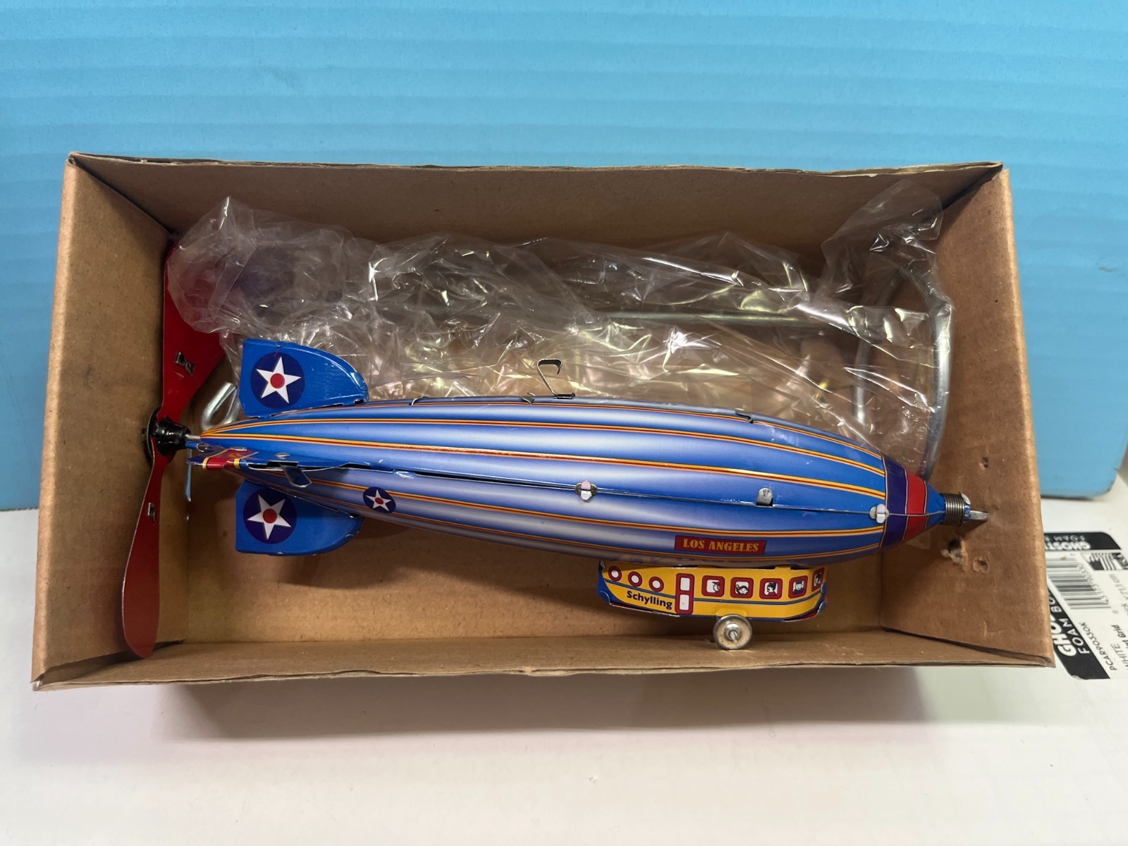 SCHYLLING LOS ANGELES ZEPPLIN TIN WIND UP RETROL TOY WITH STAND CO2