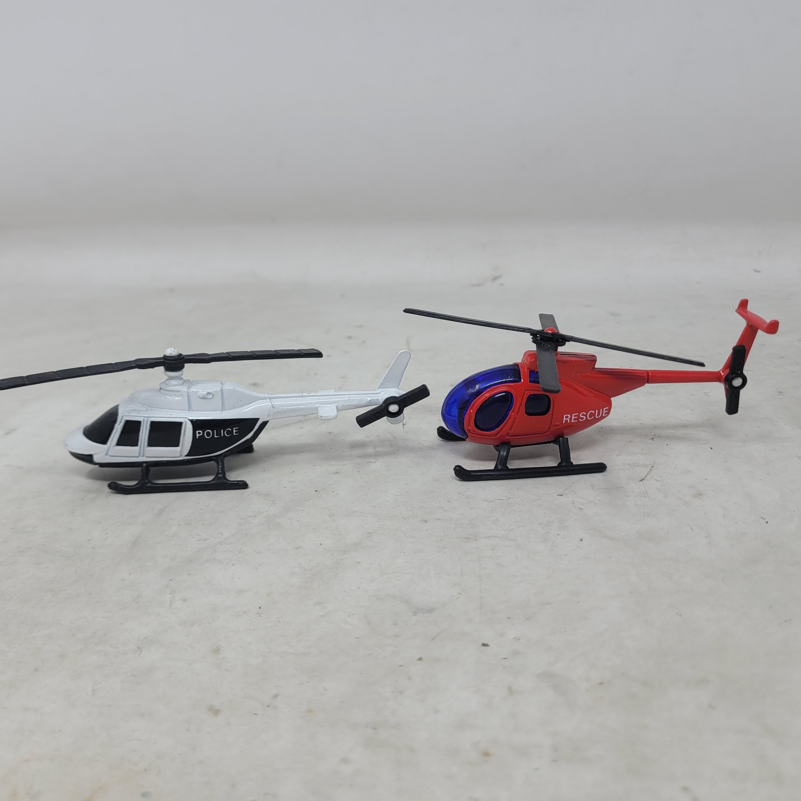 2 Diecast Toy Helicopters Set Rescue & Police (Maisto) Red White Black 1:64