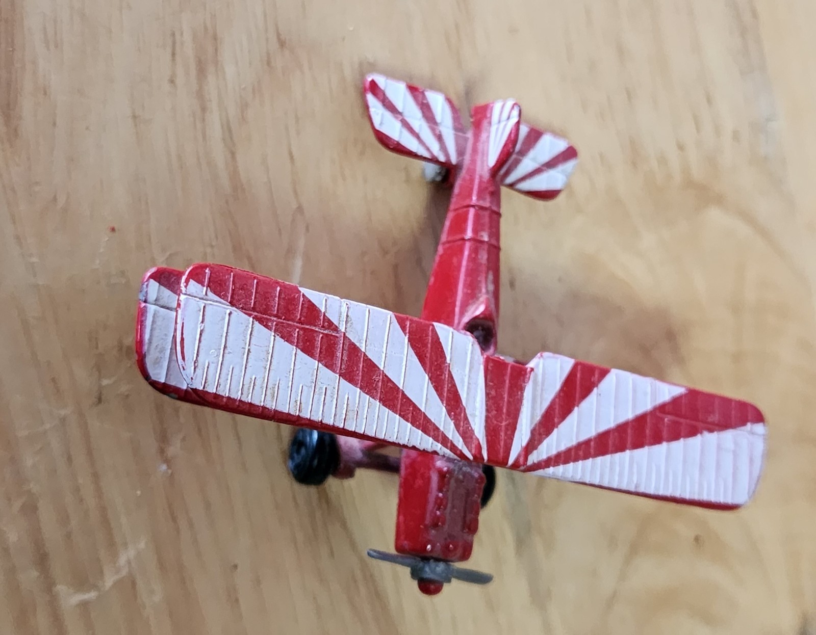 Matchbox Skybusters biplane toy featuring a distinctive red and white…
